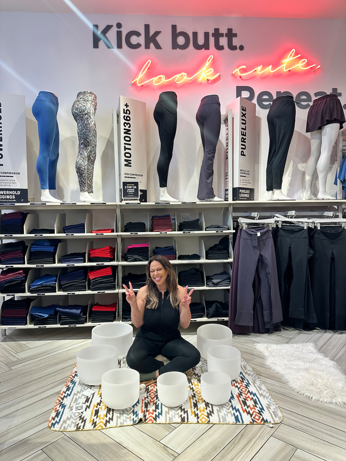 Noura Gina Ammar seated with a set of 432Hz crystal singing bowls before a community soundbath at Fabletics, The Shops at Santa Anita, Arcadia CA